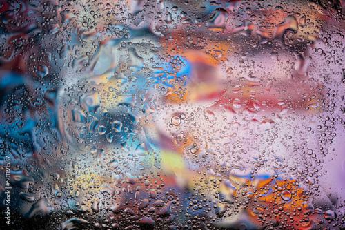 Oil bubbles in water on an abstract and colorful
