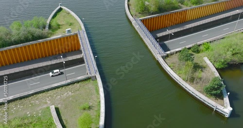 Aquaduct Veluwemeer water bridge with Two boats crossing above highway traffic, Aerial view. photo