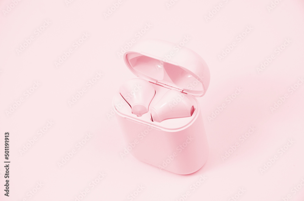 wireless headphones on a pink background. the concept of listening to music. musical relaxation illustration. modern communication devices wireless headphones on a pink background. the concept of listening to music. musical relaxation illustration. modern communication devices