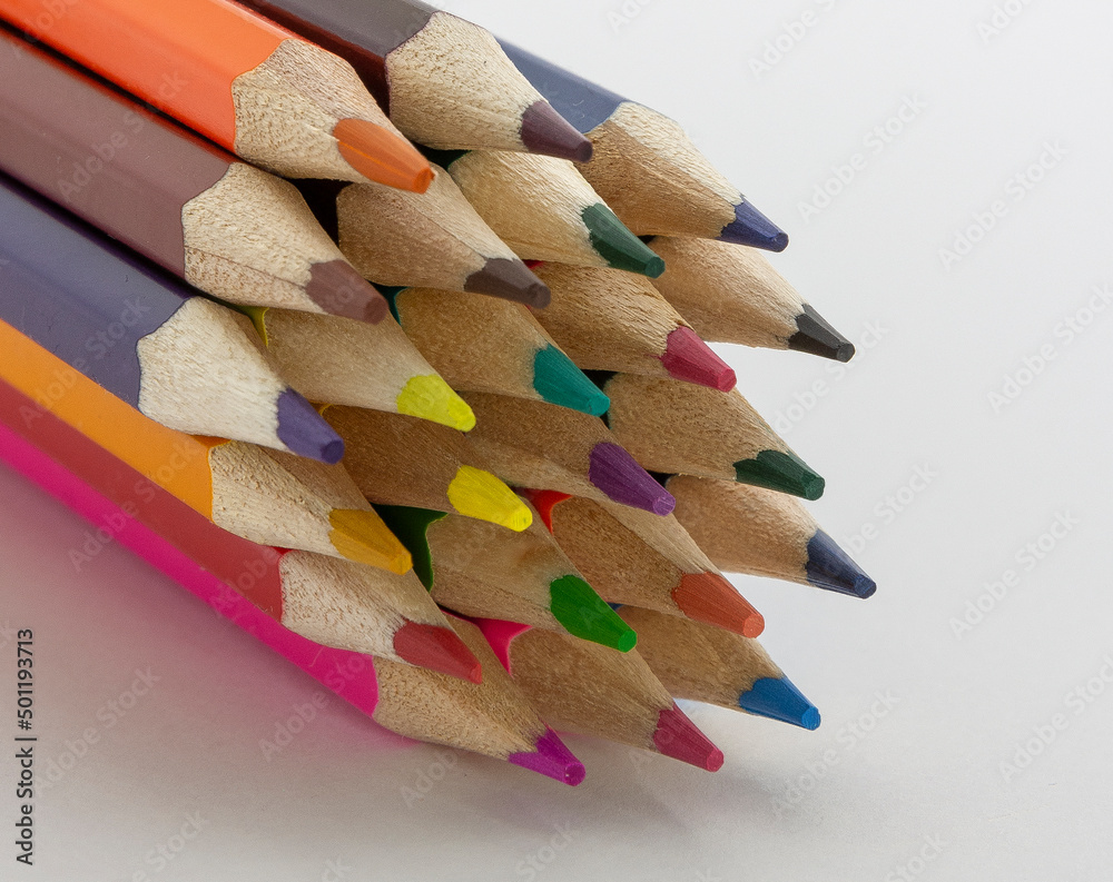 close up of colour pencils background. Color pencils on white background horizontal close up of colour pencils background. Color pencils on white background horizontal