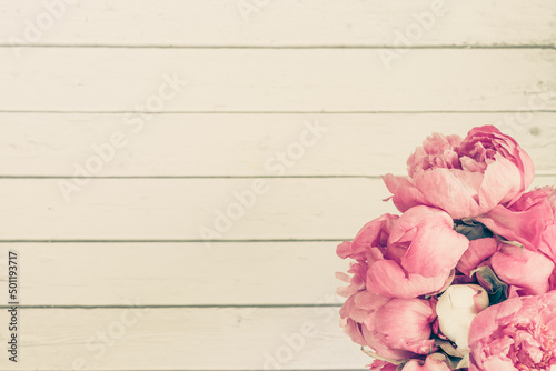 Beautiful retro pink and white peony flowers with copy space for your text
