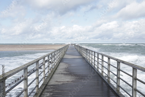 wooden bridge over the ocean © Detlef