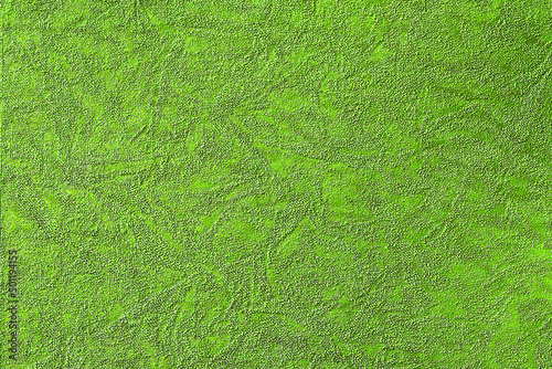 Green background with abstract pattern of various shapes, fabric and paper texture