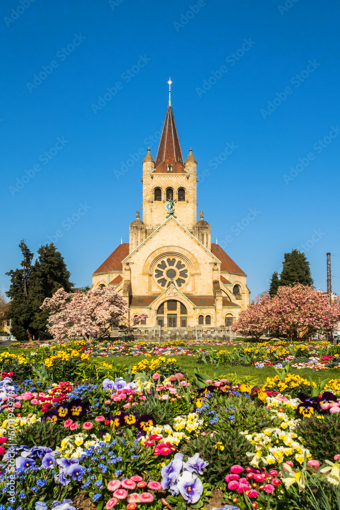 St. Paul's Church with colorful meadow and spring flower in Basel, Switzerland
