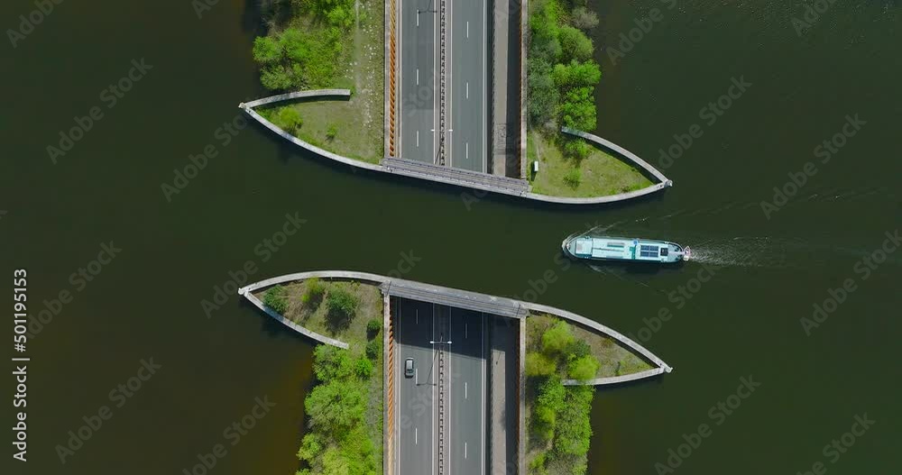 Aquaduct Veluwemeer water bridge with Two boats crossing above highway traffic, Aerial view.