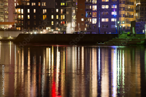 Reflections of lights from an apartment complex by the river..