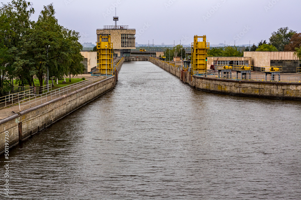 Fototapeta premium Gates open to permit ship to enter lock on Dnieper River near Zaporozhye.