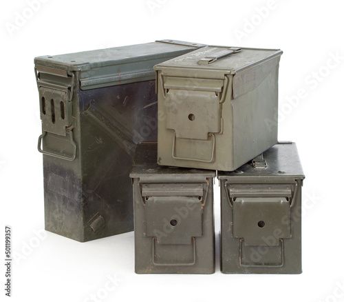 Green military ammunition boxes on white