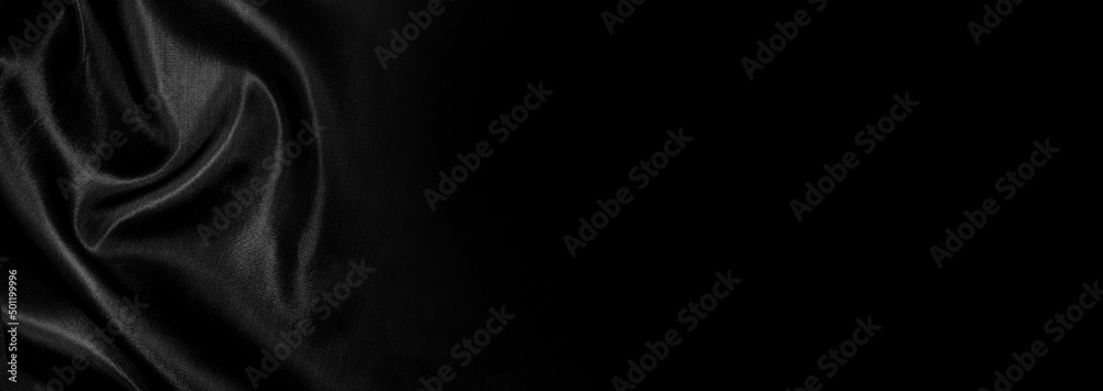 Fototapeta premium Part of the dark fabric texture of the fabric for the background and decoration of the work of art, a beautiful crumpled pattern of silk or linen. A crumpled piece of cloth