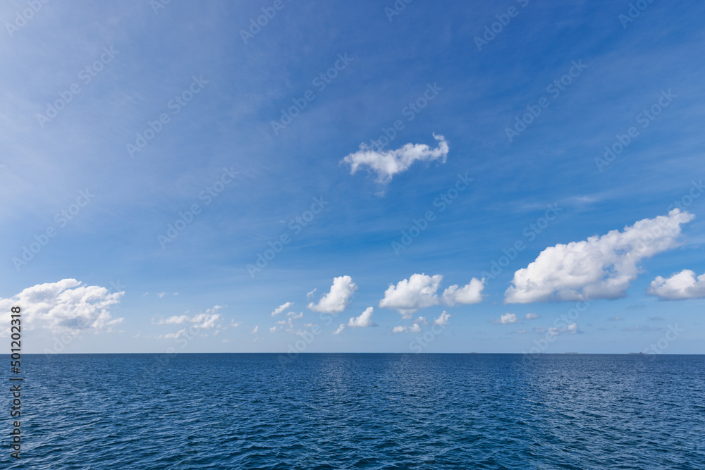 Obraz premium Perfect sky and ocean. Endless seascape, freedom ecology nature concept. Blue sea water. Ocean surface natural background on blue sky. Tropical seaside, horizon, idyllic skyline, tranquil skyscape