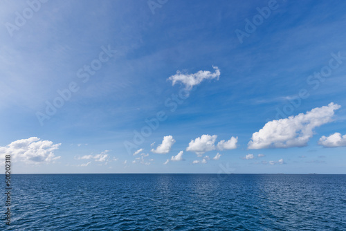 Perfect sky and ocean. Endless seascape, freedom ecology nature concept. Blue sea water. Ocean surface natural background on blue sky. Tropical seaside, horizon, idyllic skyline, tranquil skyscape