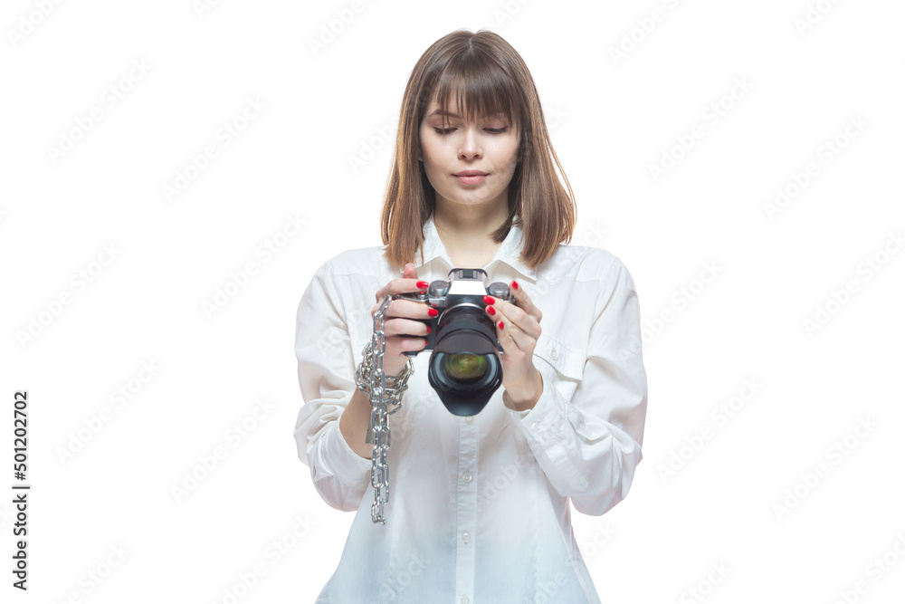 Copyright. The camera is chained to the photographer's hand. The concept of protecting the photographer from theft of his photos. Isolated on white background. Copyright. The camera is chained to the photographer's hand. The concept of protecting the photographer from theft of his photos. Isolated on white background.