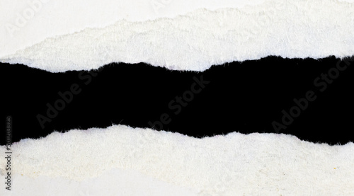 a white piece of paper on a black isolated background © Krzysztof Bubel