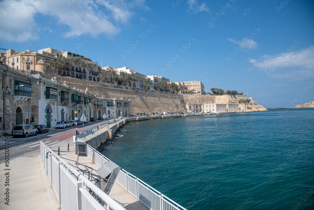 La Valletta, Malta - April 17, 2022: Coastline at sunset in La Valletta