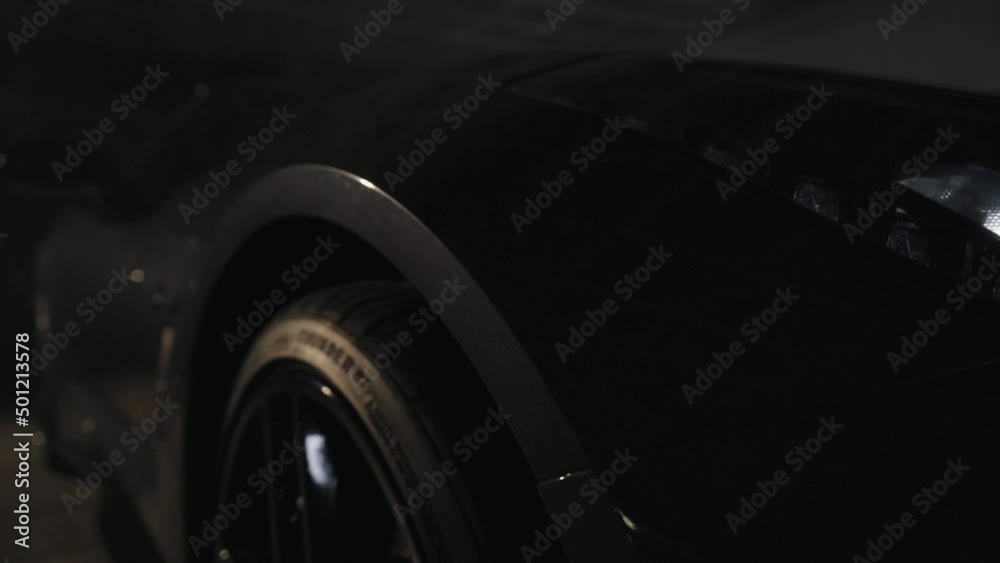 black luxury car wheel in slow motion black luxury car wheel in slow motion