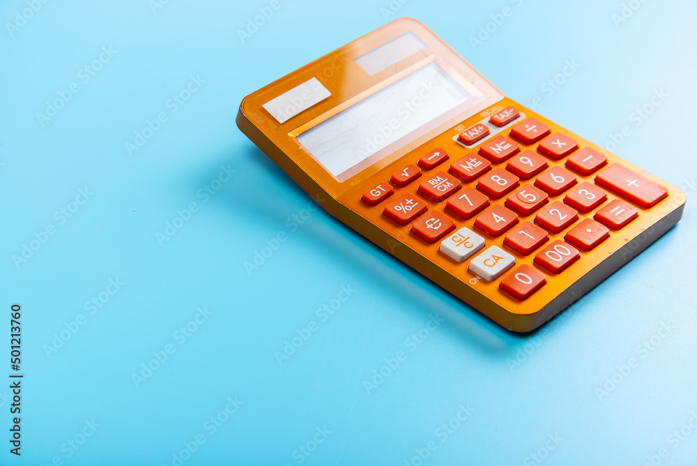 Orange bright calculator on a blue background Orange bright calculator on a blue background