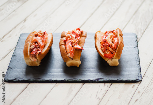 Three Lobster Rolls on Slate.