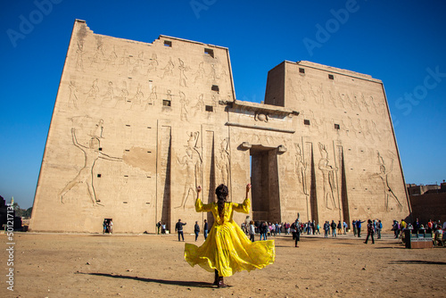 Woman looking at the Temple of Edfu, Egypt photo