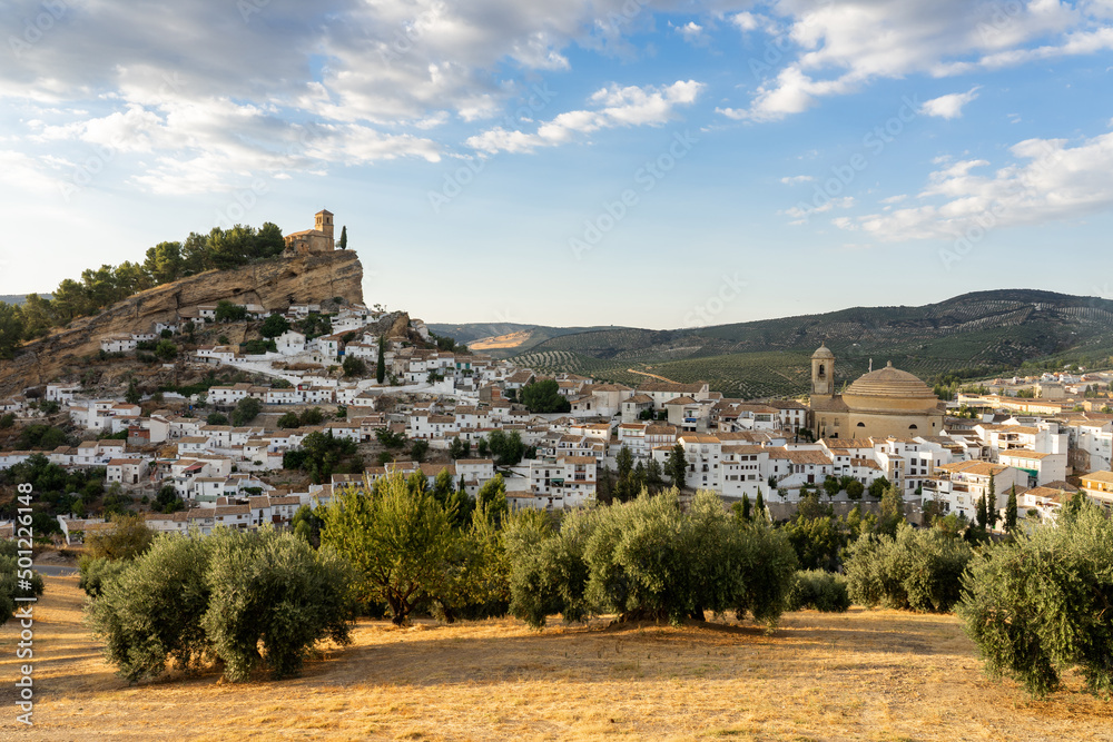 Panoramic view of Montefrio since National Geographic lookout with olive trees in the foreground at sunset. Granada, Andalucia, Spain. - obrazy, fototapety, plakaty 