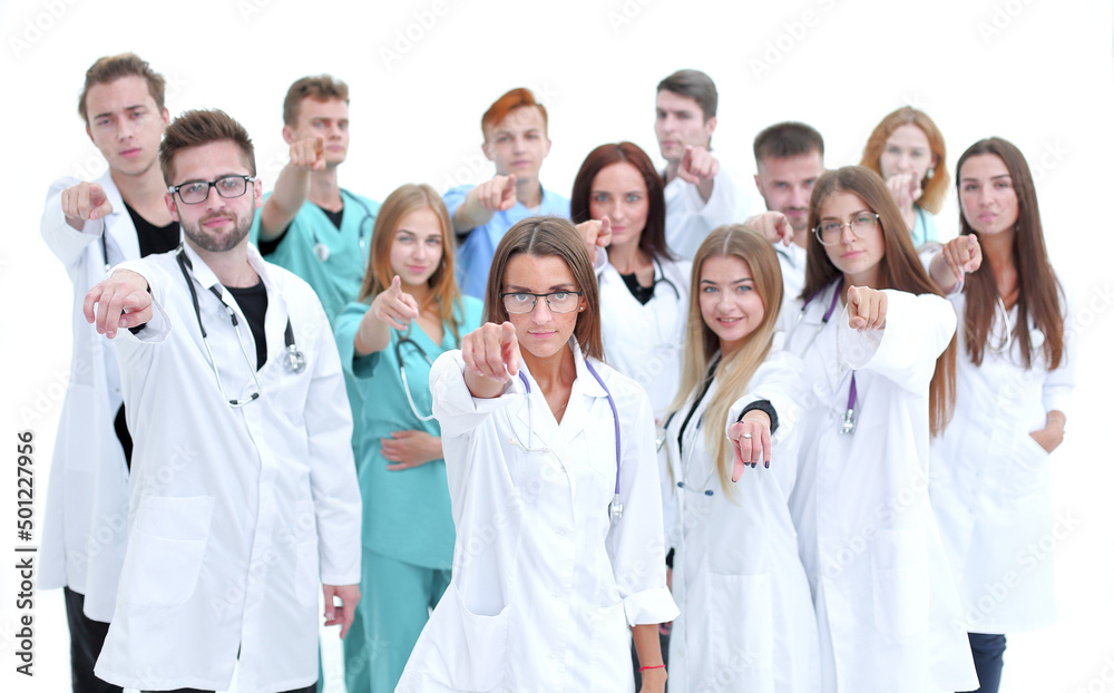 group of diverse medical professionals pointing at you group of diverse medical professionals pointing at you