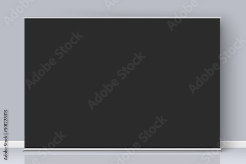 Black rollup banner with copy space standing on the grey wall background. Horizontal wide banner realistic mockup. Vector banner template design. The Black backdrop for image or text placement.