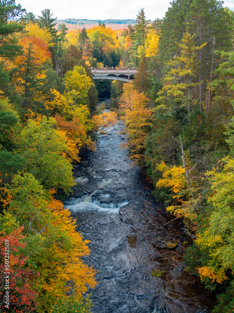 Bridge near Agate Falls in Michigan. Leaves turning colors during autumn. Bridge near Agate Falls in Michigan. Leaves turning colors during autumn.
