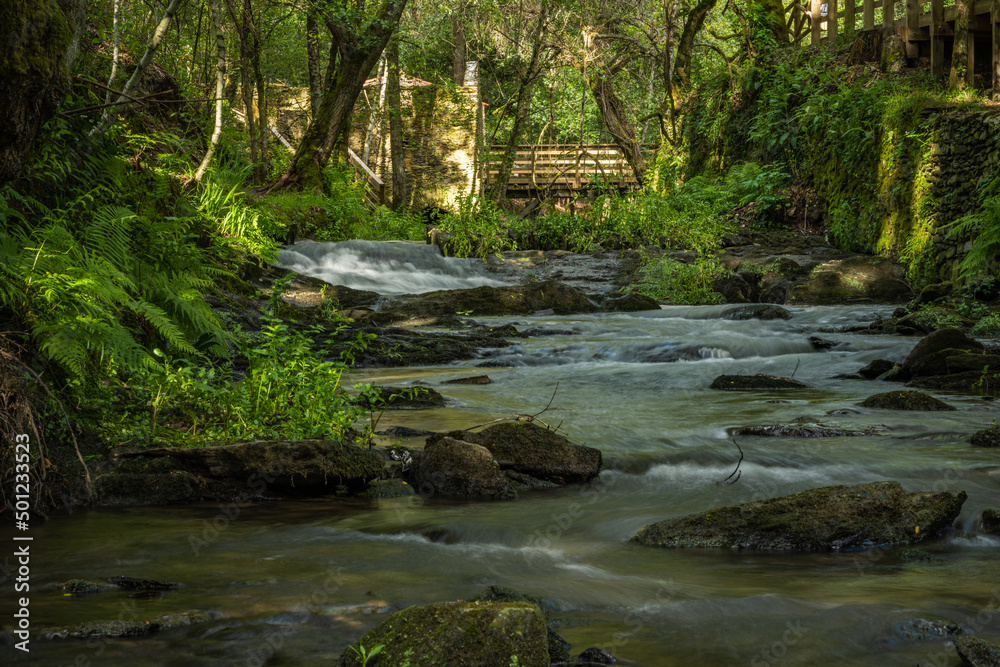 Obraz premium Surrounding landscape of the Estanislau fountain park and the Lourido river that divides the parishes of Arada and Maceda in the Municipality of Ovar, Portugal.