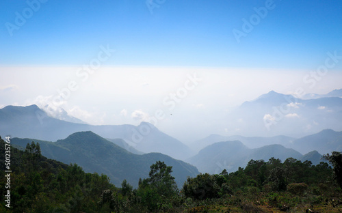 Amazing View with Clouds and Hills in Coakers Walk, Kodaikanal, tamil Nadu, India photo