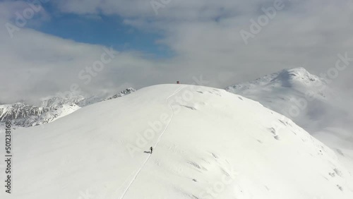 Cinematic shot of climbers on top of a mountain in British Columbia, Canada photo