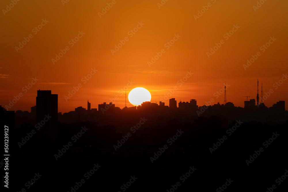 Sun rising in a city in Brazil