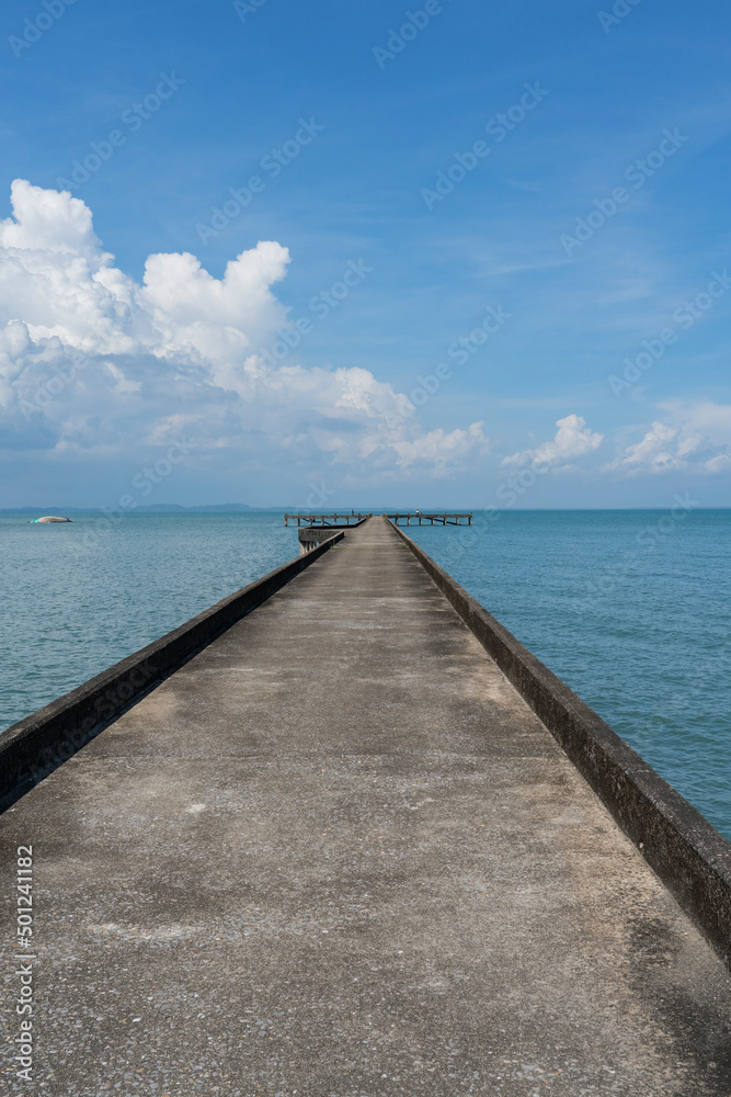 Empty pier going out to sea.