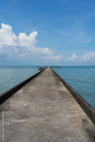 Empty pier going out to sea.