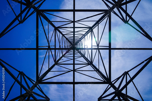 Fotografie, Obraz High voltage tower on blue sky background