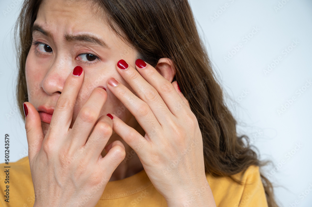 Portrait of Asian woman worried about her wrinkled on her face. Portrait of Asian woman worried about her wrinkled on her face.