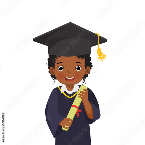cute little African schoolgirl in graduation hat and gown holding diploma certificate 