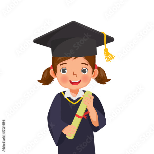 cute little schoolgirl in graduation hat and gown holding diploma certificate 