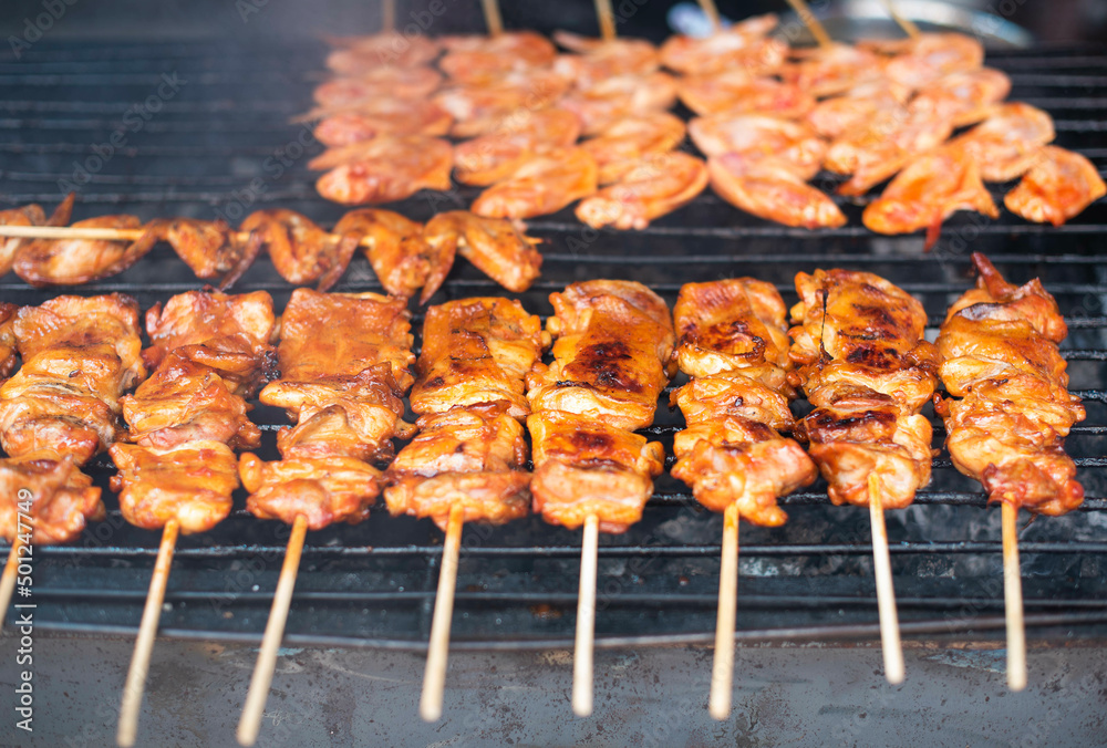 BBQ chicken skewers grilled in a charcoal oven