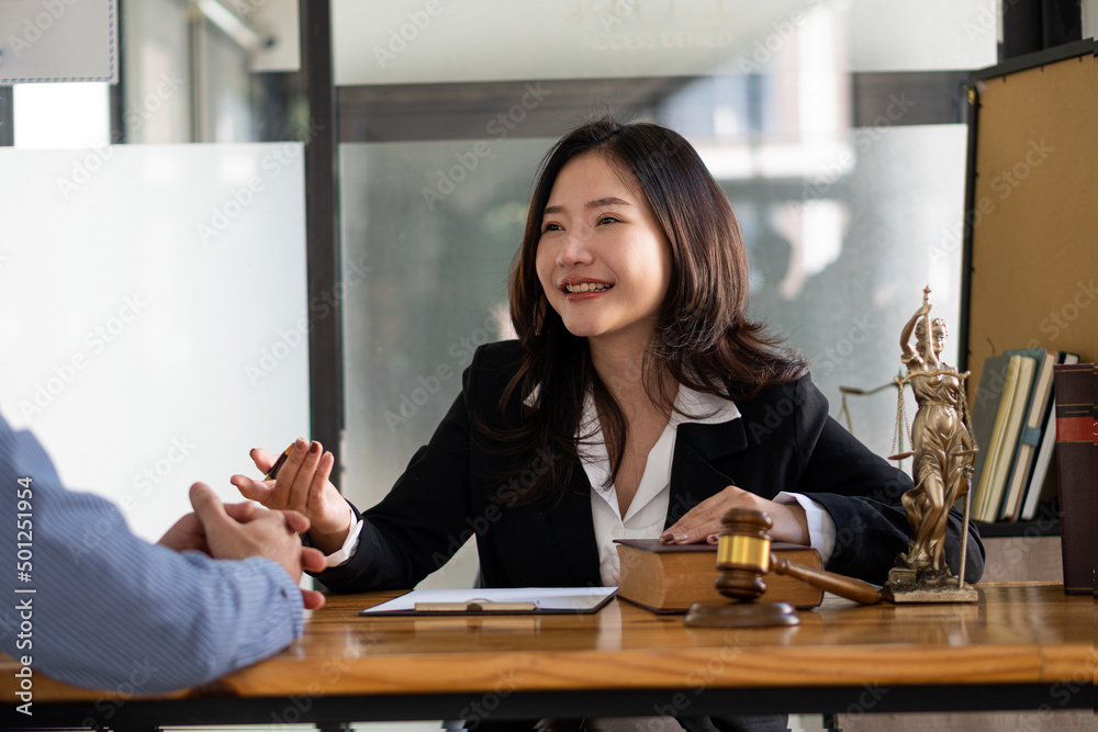 businesswoman or lawyer woman working at a desk with law books The judges hammer the scales of crime justice and the concept of legal advice. businesswoman or lawyer woman working at a desk with law books The judges hammer the scales of crime justice and the concept of legal advice.