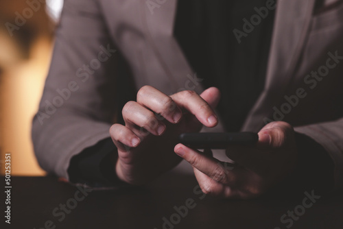 Close up hand of businessman with mobile phone. Concept of technoloy for business.
