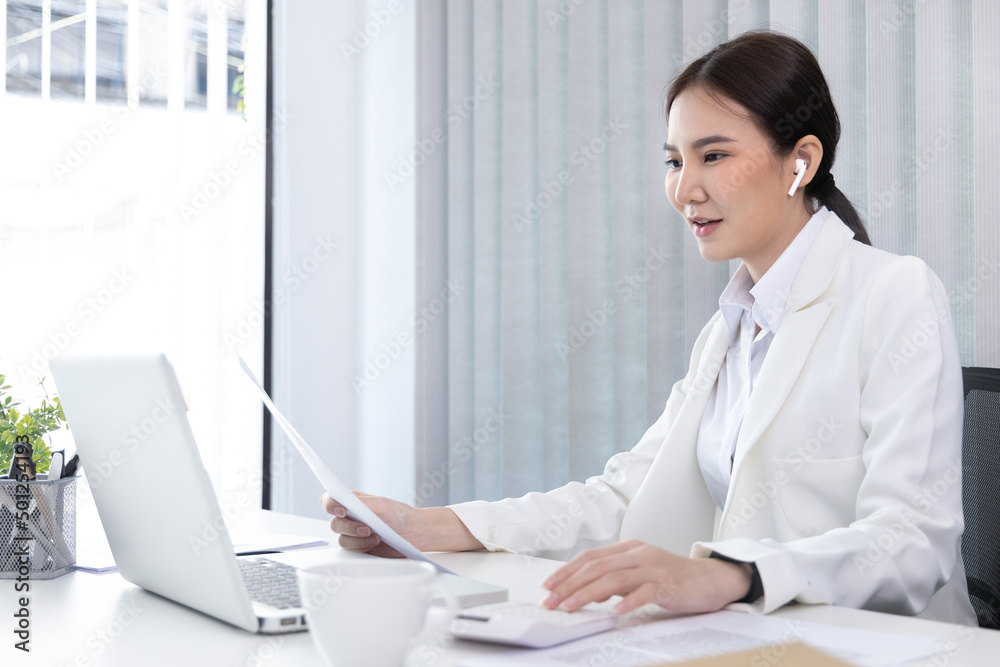 Business woman analyzing data graph in private office room, Presents Graph data and plan marketing strategies for executives who attend team meetings to analyze and develop for business. Business woman analyzing data graph in private office room, Presents Graph data and plan marketing strategies for executives who attend team meetings to analyze and develop for business.