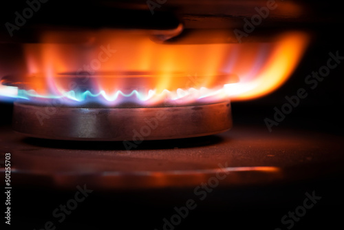Gas burner on black modern kitchen stove. kitchen gas cooker with burning fire propane. consumer natural gas