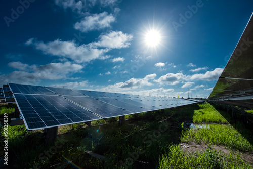 Photovoltaic modules solar power plant on dramatic sunset sky background, Alternative power energy concept to enable sustainable growth and reduce global warming and climate change photo