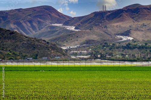 101 Ventura Highway winding through mountain pass into farm fields and valley below Camarillo California  photo