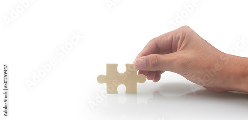 Connecting jigsaw puzzle in hand