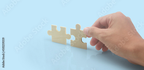 Connecting jigsaw puzzle in hand