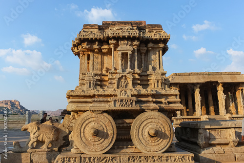 hampi stone chariot the antique stone art piece from unique angle with amazing blue sky image is taken at hampi karnataka india. it is the most impressive and truly splendid architecture in hampi.. photo