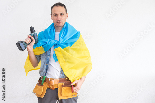 male repairman with the flag of Ukraine