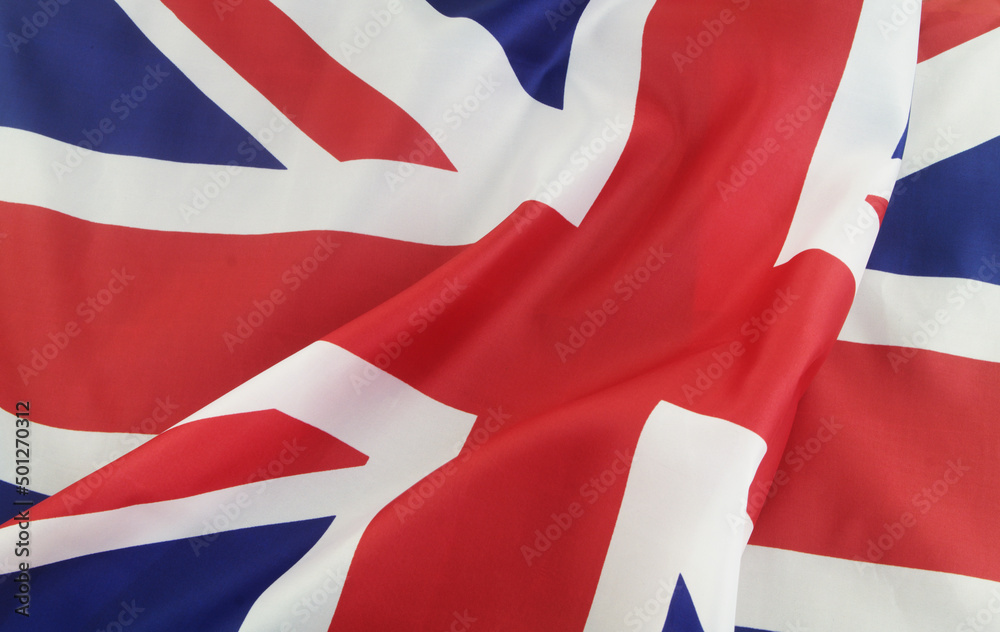 UK flag background. Close up of waved British flag. UK flag background. Close up of waved British flag.