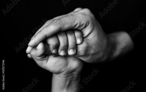 hands of the old and young person 