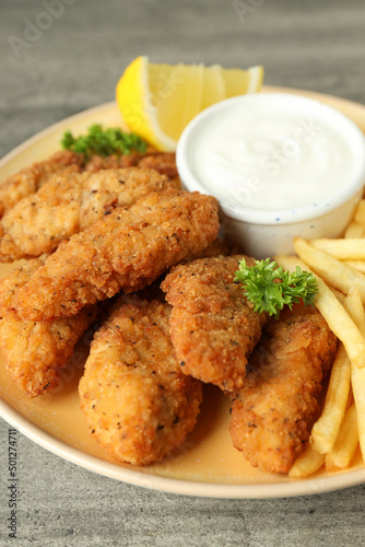 Concept of tasty food with chicken strips, close up